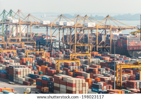 SINGAPORE- April 14: Singapore commercial port on April 14, 2014 in Singapore. It\'s the world\'s busiest port in terms of total shipping tonnage, it transships a fifth of the world shipping containers.