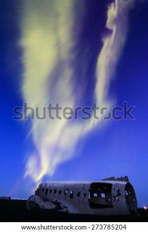 northern lights over plane wreck on the wreck beach in Vik, Iceland