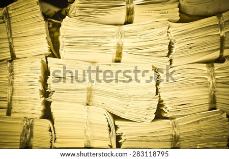 Piles of paper on the shelves