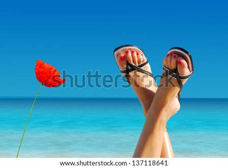 feet crossed on an island paradise