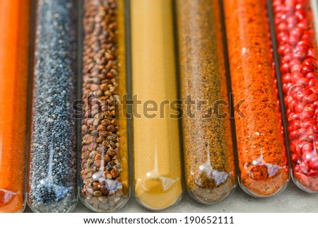 Closeup of various colorful spices, powders and herbs