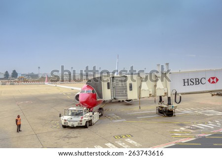 PARIS - MARS 21 : HSBC billboard on the gangway in the airplane on airport of Orly on Mars 21, 2015 in Paris, France.
