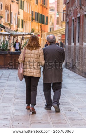 Couple walking on street in the old town of Venice
