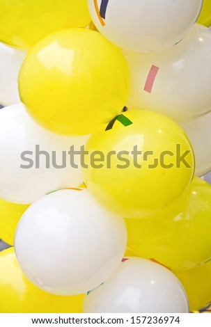 White and yellow balloons with confetti