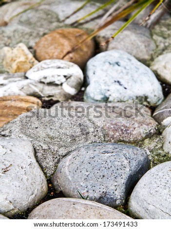 Different rocks Lying on the ground together vertical