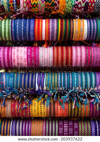 Rows of different color cloth bracelets on the market