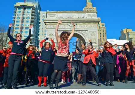 NEW YORK, NY - FEB 14: Nearly 300 women took part in a One Billion Rising flash mob dance in Washington Square Park in New York City, NY on February 14, 2013 to protest violence against women.