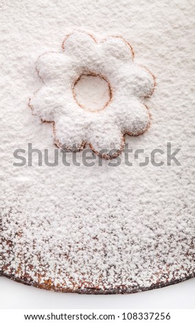 Cookies in the shape of a flower covered powdered sugar, (background for congratulations)