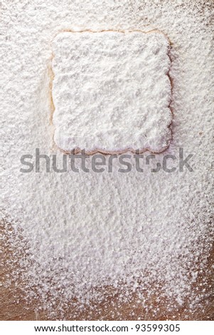 Cookies covered with powdered sugar, background for congratulations