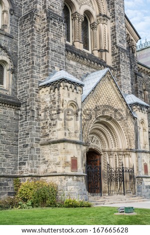TORONTO, ON, CANADA - OCTOBER 30: Aged main entrance of University College in University of Toronto, in Toronto Canada on October 30, 2013