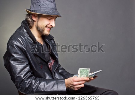 Good news. Man counting lot of money