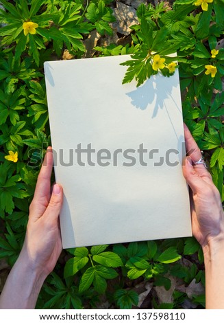 Woman hands hold flower frame with space for copy