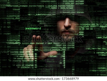 Silhouette of a hacker looking in monitor with binary codes and words