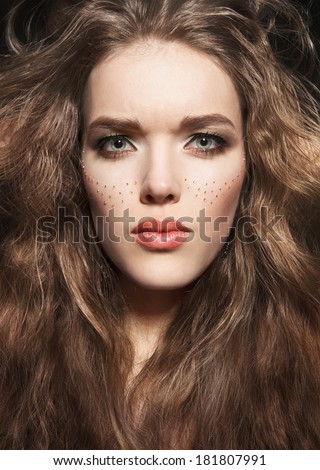 Attractive young woman portrait.thick hair and unusual appearance