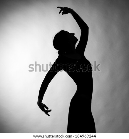 Silhouette of are female dancer