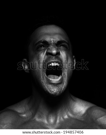 Portrait of a muscular man screaming