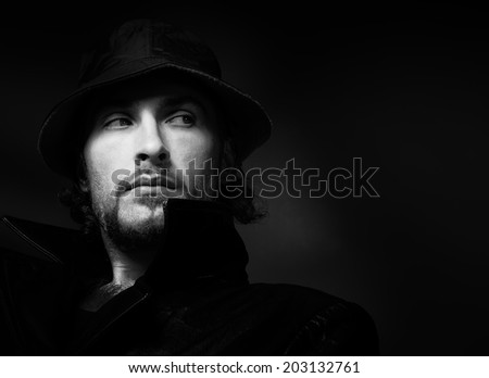 Dramatic male portrait. Black and white photo