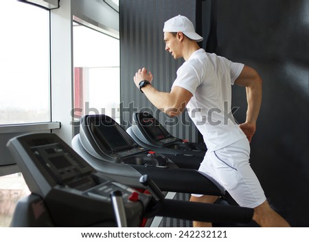 gym man running on the treadmill