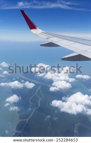Wing aircraft in the sky under earth of Thailand