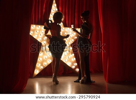 Womans on stage with broadway star on background