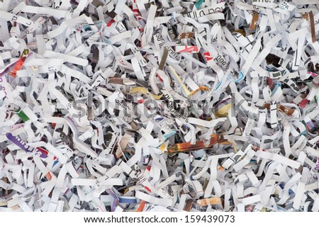 a lot of paper stripe inside the paper shredder