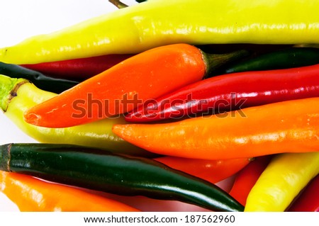 Mixed Variety Color of Hot Chili Peppers, Red,Green,Orange isolated on white background.