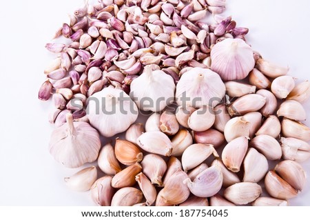 Mixed Kind of Fresh Garlic Cloves Bulb arranged in Heart shape Isolated on white background, good for health and healthy.