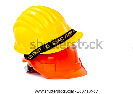Pair of Engineer Worker Helmet two Orange and Yellow with SAFETY FIRST tag design concept isolated on white background.