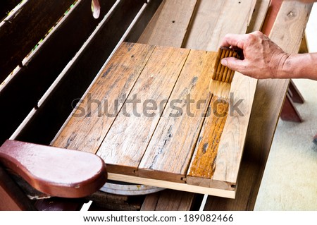 Carpenter Hand Paint Wood Work with Shellac Color to Cover and protect wood.