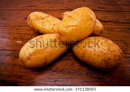 Fresh Potato on Wood Table , Country Rustic Style.