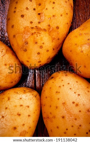 Group of Five Fresh Potato Arrange on Star Shape on Wood Table , Country Rustic Style.