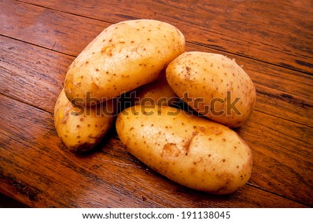 Group of Fresh Potato on Wood Table , Country Rustic Style.