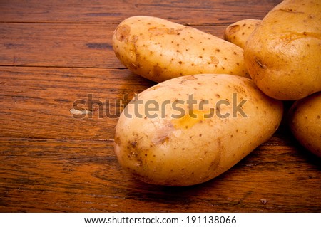 Fresh Potato on Wood Table , Country Rustic Style.