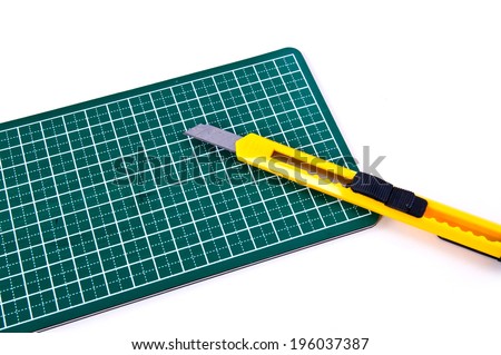 Stationery Knife Paper Cutter isolated on a white background. Concept Idea of Art and Craft.