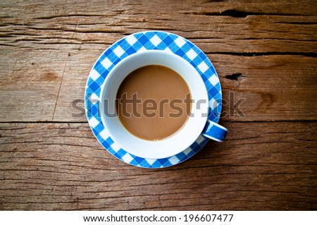 Top View Coffee Mug Blue and White on Wood Table Background, Rustic Style.