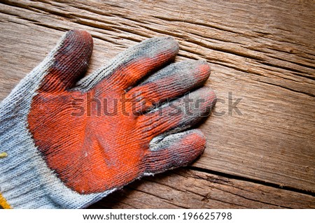 Old Vintage Worn Out Gloves, Gardener, Worker, Carpenter Concept and Idea / On Wood Background, Rustic Style.