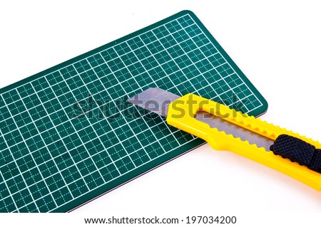 Stationery Knife Paper Cutter isolated on a white background. Concept Idea of Art and Craft.