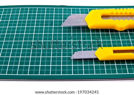 Two Big and Small Stationery Knife Paper Cutter isolated on a white background. Concept Idea of Art and Craft.