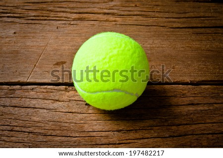 Tennis Ball on Wood Background, Sport Concept and Idea, Rustic Style.