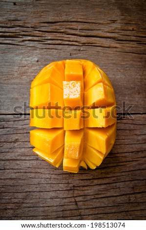 Fresh Mango , Cut in Square Shape Concept of Food Art, Idea of Decorated Food, On Wood Table Background, Rustic Style.