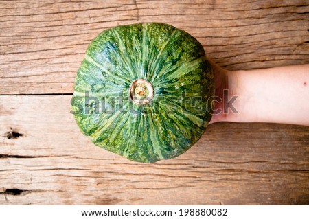 Fresh Pumpkin on Wood Table, Concept and Idea of Food Rustic Style.