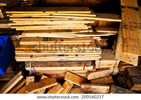 Heap of Old Wood Plank with Rust Nail in Carpentry Business and Carpenter Wood Work for Background and Texture.