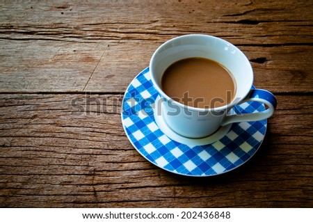 Coffee Mug Blue and White on Wood Table Background, Rustic Still Life Style.