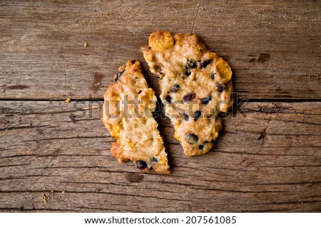 Homemade Bake Cracked Break Chocolate Chip Cookie on Wood Table Background, Rustic Still Life Style.