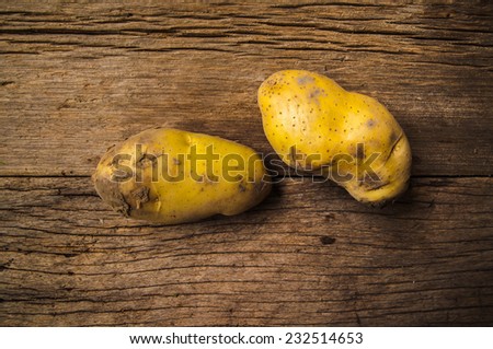 Fresh Potato on Wood Table Background, Concept and Idea of Food Cook Rustic Still life Style.