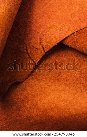 Brown, Orange Leather for Concept and Idea Style of Fine Leather Crafting, Handcrafts, Handmade, handcrafted, leather worker. / Background Textured and Wallpaper. Rustic Style. Vertical.