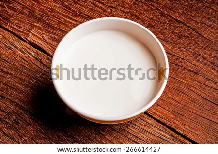 Fresh Organic Milk in Ceramic Bowl, Concept and Idea of Drink, Breakfast, Food Cooking, Rustic Still Life Style / on Wood Table Background.