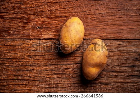 Fresh Potato on Wood Table Background, Concept and Idea of Food, Cook, Harvest, Organic Farm Life, Rustic Still life Style.