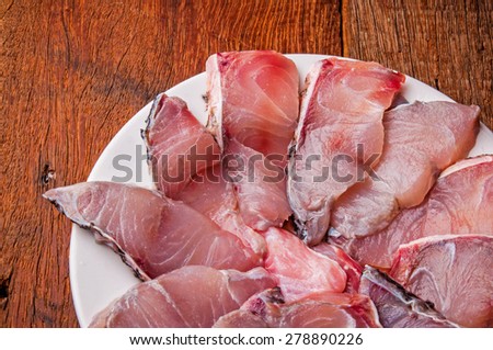Barramundi, Silver Perch, White Perch, Sea Bass. Fresh Ocean Fish Sliced. Cooking Idea. / on Wood Table Background, Rustic Still Life Style.