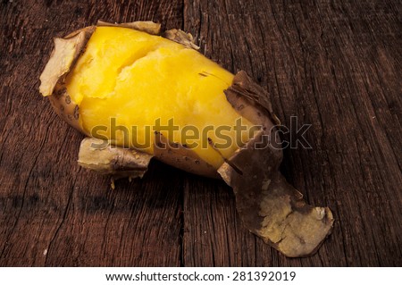 Fresh Hot Boiled Potato with Peeled Skins on Wood Table Background, Concept and Idea of Food Cook Rustic Still life Style.
